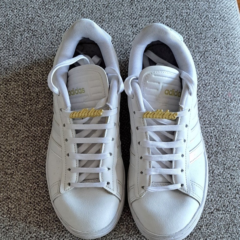 adidas White Athletic Shoes with Gold Accents